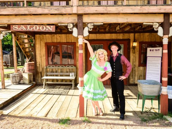 Western entertainers on the saloon porch at Enchanted Springs Ranch